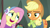 Size: 1280x720 | Tagged: safe, screencap, applejack, fluttershy, earth pony, pegasus, pony, best gift ever, applejack is not amused, cute, earmuffs, holly the hearths warmer doll, unamused