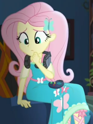 Size: 719x958 | Tagged: safe, screencap, fluttershy, better together, choose your own ending, costume conundrum, equestria girls, controller, cropped, cute, female, gaming headset, headset, headset mic, looking down, sitting, sofa, solo, sunset's apartment, thinking