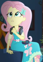 Size: 673x964 | Tagged: safe, screencap, fluttershy, better together, choose your own ending, costume conundrum, equestria girls, controller, cropped, female, geode of fauna, headset, headset mic, magical geodes, sitting, sofa, solo, sunset's apartment, thinking