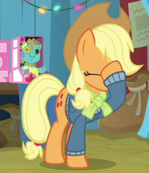 Size: 396x460 | Tagged: safe, screencap, applejack, earth pony, pony, best gift ever, cropped, eyes closed, facehoof, female, holly the hearths warmer doll, mare, raised hoof, solo