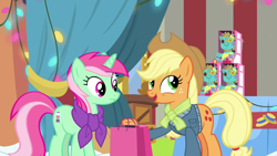 Size: 1280x720 | Tagged: safe, screencap, applejack, minty bubblegum, earth pony, pony, unicorn, best gift ever, bag, clothes, duo, female, holly the hearths warmer doll, jacket, mare, scarf