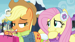 Size: 1280x720 | Tagged: safe, screencap, applejack, fluttershy, earth pony, pegasus, pony, best gift ever, amused, applejack's hat, clothes, cowboy hat, cute, cutie mark, earmuffs, hat, hoof over mouth, smiling, smirk, stetson, sweater