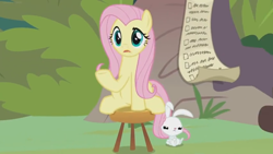 Size: 1600x900 | Tagged: safe, screencap, angel bunny, fluttershy, pegasus, pony, rabbit, she talks to angel, animal, checklist, duo, female, grumpy, list, male, mare, paper, sitting, stool, sweet feather sanctuary, upset