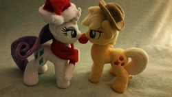 Size: 5312x2988 | Tagged: safe, artist:valmiiki, derpibooru exclusive, applejack, rarity, alternate costumes, apple, christmas, clothes, cowboy hat, cute, duo, female, food, hat, holiday, irl, jackabetes, lesbian, nom, photo, plushie, raribetes, rarijack, santa hat, scarf, shipping, that pony sure does love apples