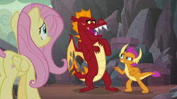 Size: 1920x1080 | Tagged: safe, screencap, fluttershy, garble, smolder, dragon, pegasus, pony, sweet and smoky, angry, brother and sister, butt, defensive, displeased, fangs, female, folded wings, frown, horns, little sister, looking at each other, male, mare, plot, pointing, siblings, smolder is not amused, teenaged dragon, teenager, unamused, wings