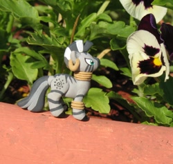 Size: 853x811 | Tagged: safe, derpibooru import, zecora, zebra, figurine, flower, irl, nature, photo, sculpture