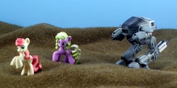 Size: 1800x900 | Tagged: safe, artist:seanmonster, daisy, flower wishes, roseluck, ed-209, irl, photo, robocop, toy