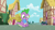 Size: 1280x720 | Tagged: safe, derpibooru import, screencap, spike, dragon, secret of my excess, cupcake, food, ponyville, sapphire, sapphire cupcake, sitting, solo