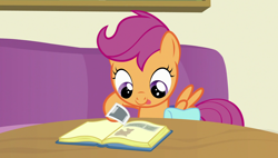 Size: 1920x1090 | Tagged: safe, screencap, scootaloo, pegasus, pony, parental glideance, book, cute, cutealoo, female, filly, photo, saddle bag, scrapbook, smiling, solo, spread wings, tongue out, wings