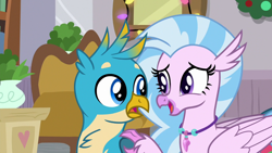 Size: 1280x720 | Tagged: safe, derpibooru import, screencap, gallus, silverstream, griffon, hippogriff, the hearth's warming club, duo, female, jewelry, male, necklace, open beak, shipping fuel