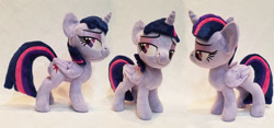 Size: 1024x481 | Tagged: safe, artist:plushypuppy, derpibooru import, twilight sparkle, twilight sparkle (alicorn), alicorn, pony, female, folded wings, irl, lidded eyes, mare, photo, plushie, solo, standing