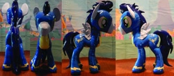 Size: 1280x562 | Tagged: safe, artist:plushypuppy, derpibooru import, soarin', pegasus, pony, clothes, irl, male, photo, plushie, shiny, solo, spread wings, stallion, standing, uniform, wings, wonderbolts uniform