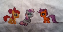 Size: 960x497 | Tagged: safe, apple bloom, scootaloo, sweetie belle, pony, cross stitch, cutie mark crusaders