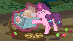 Size: 1280x720 | Tagged: safe, derpibooru import, screencap, sugar belle, pony, unicorn, the break up breakdown, apple, broken, cart, eyes closed, female, food, glowing horn, magic, mare, mud, solo, straining, telekinesis