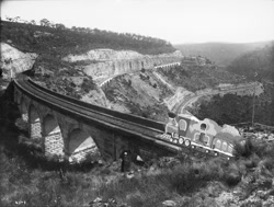 Size: 1024x776 | Tagged: safe, artist:didgereethebrony, derpibooru import, australia, black and white, blue mountains, bridge, friendship express, grayscale, irl, lithgow, mlp in australia, monochrome, photo, railroad, railway track, steam train, train, valley, zig zag railway