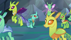 Size: 1280x720 | Tagged: safe, derpibooru import, screencap, clypeus, cornicle, changedling, changeling, to where and back again, background changeling, changeling kingdom, flying