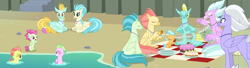 Size: 3990x1080 | Tagged: safe, derpibooru import, edit, screencap, classical hippogriff, hippogriff, seapony (g4), surf and/or turf, baby seaponies (g4), background hippogriff, background sea pony, beach, beach ball, bowl, bread, cake, cliff, coexist, cookie, cup, cupcake, drums, eyes closed, fledgeling, food, jaffa cake (hippogriff), picnic, picnic blanket, plate, playing, prone, seashell, seaweed, sitting, unnamed hippogriff, unnamed seapony