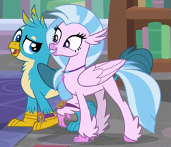 Size: 609x523 | Tagged: safe, derpibooru import, screencap, gallus, silverstream, classical hippogriff, griffon, hippogriff, a matter of principals, cropped, cute, diastreamies, feathered fetlocks, female, gallabetes, grin, male, raised claw, shipping fuel, smiling