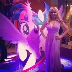 Size: 960x960 | Tagged: safe, twilight sparkle, twilight sparkle (alicorn), alicorn, human, pony, my little pony: the movie, breasts, cleavage, clothes, dress, female, hand on hip, irl, looking at you, photo, tara strong, toy fair, toy fair 2017