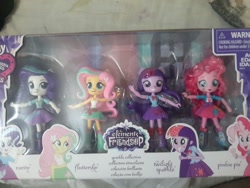 Size: 1280x960 | Tagged: safe, derpibooru import, fluttershy, pinkie pie, rarity, twilight sparkle, twilight sparkle (alicorn), alicorn, equestria girls, doll, equestria girls logo, equestria girls minis, irl, photo, toy