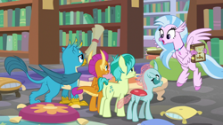 Size: 1280x720 | Tagged: safe, derpibooru import, screencap, gallus, ocellus, sandbar, silverstream, smolder, changedling, changeling, classical hippogriff, dragon, earth pony, griffon, hippogriff, pony, what lies beneath, book, bookshelf, dragoness, female, library, male, pillow, scroll, teenager