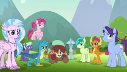Size: 1280x720 | Tagged: safe, derpibooru import, screencap, bifröst, gallus, night view, november rain, ocellus, sandbar, silverstream, smolder, yona, changedling, changeling, classical hippogriff, dragon, earth pony, griffon, hippogriff, pegasus, pony, unicorn, yak, school raze, bow, cloven hooves, colored hooves, dragoness, female, flying, friendship student, hair bow, jewelry, looking at you, male, mare, monkey swings, necklace, stallion, student six, teenager