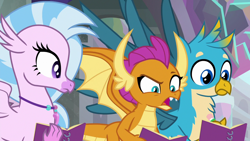 Size: 1280x720 | Tagged: safe, derpibooru import, screencap, gallus, silverstream, smolder, dragon, griffon, hippogriff, the end in friend, dragoness, female, jewelry, male, necklace, notebook, open mouth, raised eyebrow, spread wings, wings