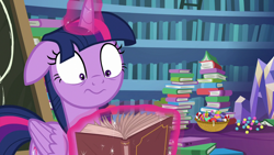 Size: 1280x720 | Tagged: safe, derpibooru import, screencap, twilight sparkle, twilight sparkle (alicorn), alicorn, best gift ever, book, bookshelf, candy, candy cane, chalkboard, floppy ears, food, shocked, solo