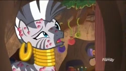 Size: 1037x585 | Tagged: safe, derpibooru import, screencap, zecora, zebra, a rockhoof and a hard place, bee sting, ear piercing, earring, female, jewelry, mare, neck rings, pain, piercing, raised eyebrow, why