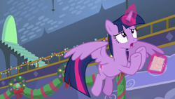 Size: 1280x720 | Tagged: safe, derpibooru import, screencap, twilight sparkle, twilight sparkle (alicorn), alicorn, best gift ever, christmas wreath, solo, wreath