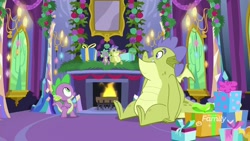 Size: 1920x1080 | Tagged: safe, derpibooru import, screencap, sludge (g4), spike, dragon, father knows beast, doll, duo, fake hearth's warming eve, fireplace, hearth's warming doll, hearth's warming eve, male, present, toy, winged spike