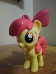 Size: 3120x4160 | Tagged: safe, derpibooru import, photographer:apex soundwave, apple bloom, earth pony, pony, bow, collectible, female, filly, funko, irl, mare, photo, small, solo, toy, vinyl collectible, vinyl figure