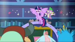 Size: 1669x941 | Tagged: safe, derpibooru import, screencap, gallus, ocellus, spike, twilight sparkle, twilight sparkle (alicorn), yona, alicorn, dragon, pony, a matter of principals, classroom, duo focus, female, flying, happy, hooves on hips, male, mare, school of friendship, smiling, winged spike, wings