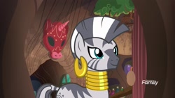 Size: 1920x1080 | Tagged: safe, derpibooru import, screencap, zecora, zebra, a rockhoof and a hard place, ear piercing, earring, female, jewelry, mare, neck rings, piercing, smiling, solo