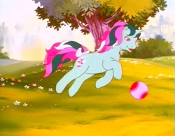 Size: 737x574 | Tagged: safe, derpibooru import, screencap, fizzy, pony, twinkle eyed pony, unicorn, g1, my little pony: the movie (g1), ball, cute, female, flower, jumping, smiling, solo, tree