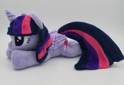 Size: 957x658 | Tagged: safe, artist:lunarchik13, derpibooru import, twilight sparkle, twilight sparkle (alicorn), alicorn, pony, beanie (plushie), female, folded wings, irl, mare, photo, plushie, prone, solo, wings