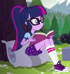 Size: 536x569 | Tagged: safe, derpibooru import, screencap, sci-twi, twilight sparkle, equestria girls, legend of everfree, book, camp everfree outfits, clothes, converse, cropped, female, glasses, pillow, ponytail, shoes, shorts, sitting, smiling, sneakers, socks, solo