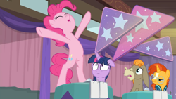Size: 1600x900 | Tagged: safe, derpibooru import, screencap, cranky doodle donkey, pinkie pie, sunburst, twilight sparkle, twilight sparkle (alicorn), alicorn, earth pony, pony, a trivial pursuit, bell, bipedal, curtains, floppy ears, notepad, on table, outstretched arms, outstretched hoof, shocked, standing, stars, table