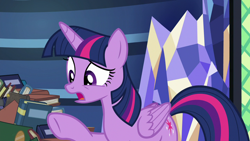 Size: 1280x720 | Tagged: safe, derpibooru import, screencap, twilight sparkle, twilight sparkle (alicorn), alicorn, father knows beast, book, library, solo, twilight's castle, twilight's castle library