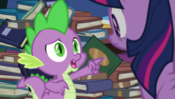 Size: 1280x720 | Tagged: safe, derpibooru import, screencap, spike, twilight sparkle, twilight sparkle (alicorn), alicorn, dragon, father knows beast, book, library, pointing, twilight's castle, twilight's castle library