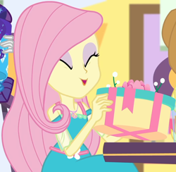 Size: 1004x980 | Tagged: safe, screencap, fluttershy, rarity, better together, equestria girls, holidays unwrapped, applejack's hat, canterlot mall, chair, clothes, cowboy hat, cropped, dashing through the mall, dress, eyes closed, female, flower, geode of fauna, gift box, gift giving, hat, jewelry, magical geodes, mall, necklace, present, sitting, smiling, solo focus, table, waistband