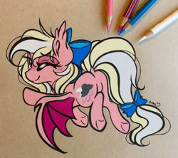 Size: 3123x2768 | Tagged: safe, artist:emberslament, derpibooru import, oc, oc only, oc:bay breeze, bat pony, bat ponified, blushing, bow, colored pencil drawing, colored pencils, cute, dock, fangs, female, flying, hair bow, looking at you, looking back, looking back at you, mare, ocbetes, one eye closed, photo, race swap, solo, tail bow, traditional art, underhoof, wink