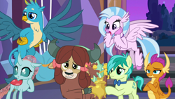 Size: 1920x1080 | Tagged: safe, screencap, gallus, ocellus, sandbar, silverstream, smolder, yona, changedling, changeling, classical hippogriff, dragon, earth pony, griffon, hippogriff, pony, yak, she's all yak, best friends, bow, bowtie, claws, cloven hooves, colored hooves, crossed arms, cute, diaocelles, diastreamies, dragoness, female, flying, folded wings, gallabetes, grin, hair bow, hands on hip, horns, jewelry, male, monkey swings, necklace, raised eyebrow, sandabetes, smiling, smolderbetes, smugder, spread wings, student six, talons, teenager, trophy, wings, yonadorable