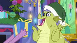 Size: 1920x1080 | Tagged: safe, derpibooru import, screencap, sludge (g4), spike, dragon, father knows beast, christmas, christmas decoration, christmas ornament, decoration, discovery family logo, excited, hat, hearth's warming, holiday, male, open mouth, present, santa hat, twilight's castle