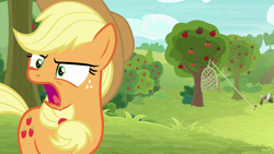 Size: 1280x720 | Tagged: safe, derpibooru import, screencap, applejack, earth pony, pony, going to seed, apple, apple tree, female, freckles, mare, net, open mouth, solo, trap (device), tree