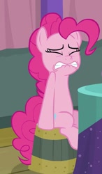 Size: 584x998 | Tagged: safe, derpibooru import, screencap, pinkie pie, earth pony, pony, a trivial pursuit, cropped, lip bite, out of context, sitting, solo