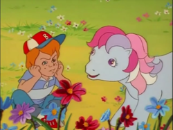 Size: 641x480 | Tagged: safe, screencap, danny williams, sweet stuff, g1, my little pony 'n friends, the magic coins, baseball cap, cap, cute, flower, hat, sweet sweet stuff