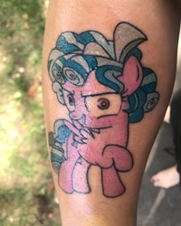 Size: 1080x1350 | Tagged: safe, cozy glow, human, pegasus, pony, evil, evil grin, female, filly, grin, irl, irl human, photo, pure concentrated unfiltered evil of the utmost potency, raised hoof, smiling, tattoo