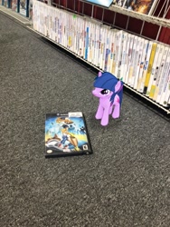 Size: 3024x4032 | Tagged: safe, photographer:undeadponysoldier, twilight sparkle, unicorn twilight, pony, unicorn, box art, female, game rating, gamecube, mare, solo, the game father, tiny, tiny ponies, whirl tour, wii