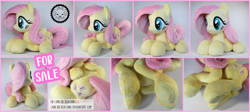 Size: 5010x2247 | Tagged: safe, artist:lioncubcreations, fluttershy, pegasus, auction, irl, lying down, photo, plushie, solo